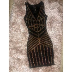 Black dress with multi-colored rhinestones.